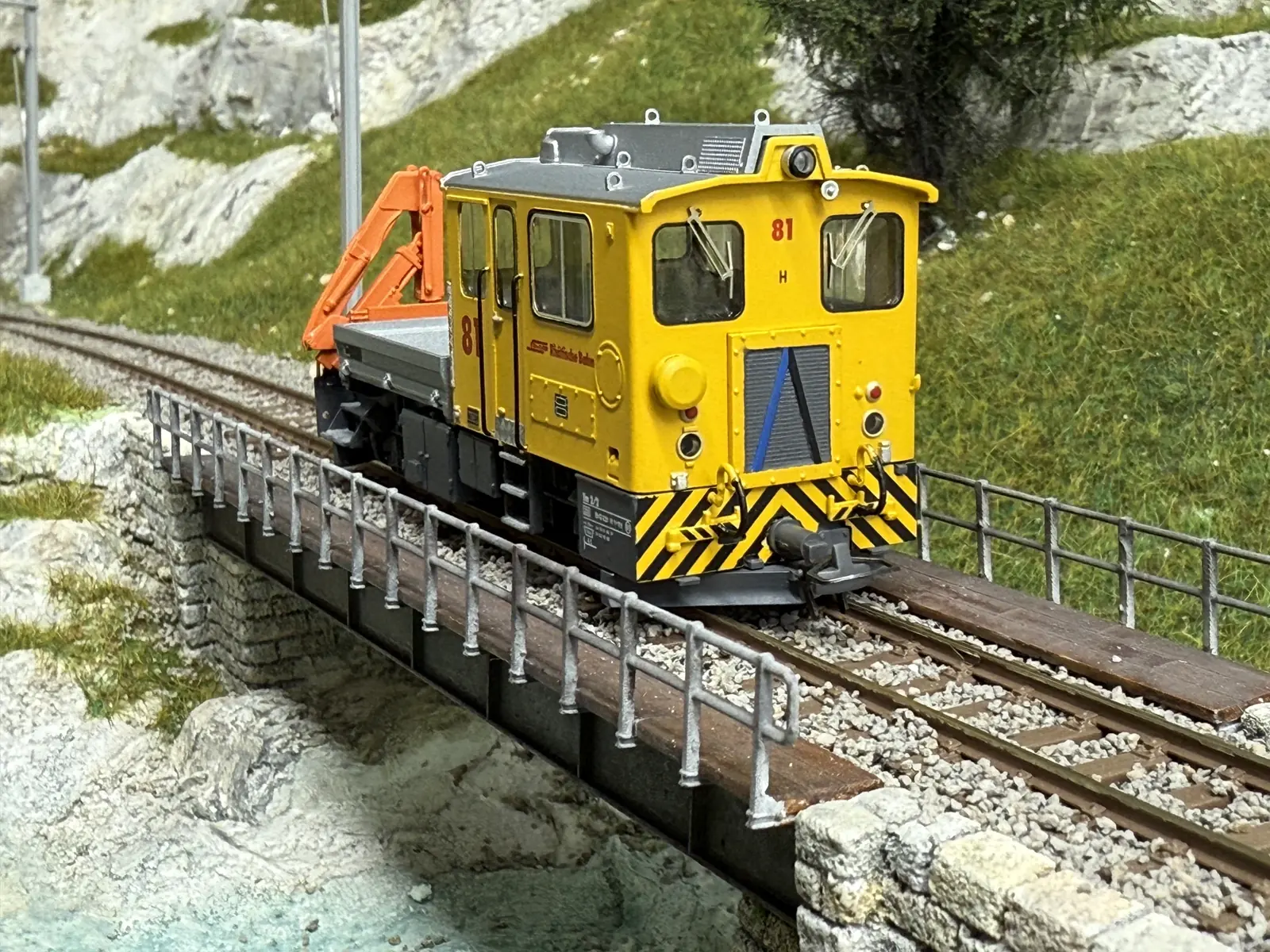 Front view of a yellow crane vehicle
