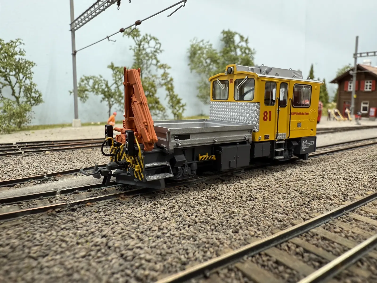 Side view of a yellow crane vehicle