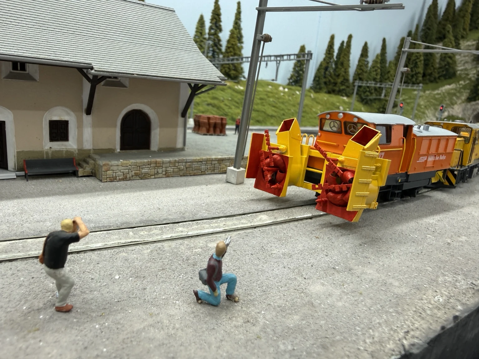 Model photographers taking pictures of the rotary snow blower at the station
